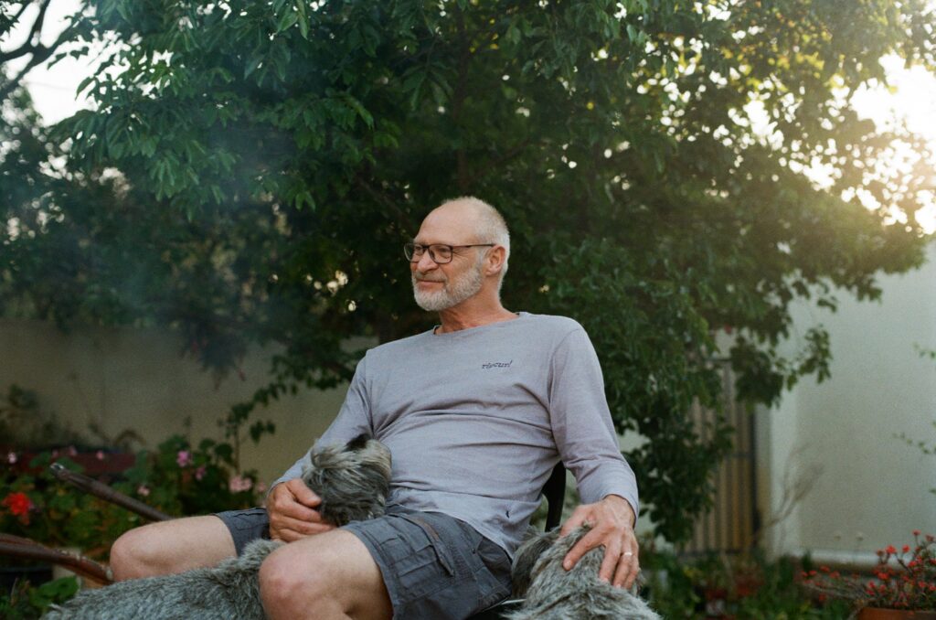 Portrait of man with dogs on film by Ashlee Kovachi